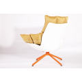 white husk chair with orange seat cushion